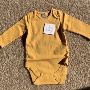 Mustard yellow baby onesie. Size 0-3 months.